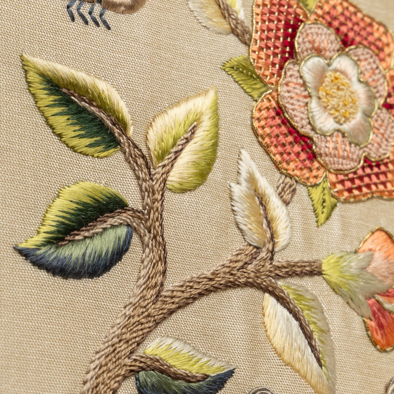 Close-up of embroidered floral design on fabric